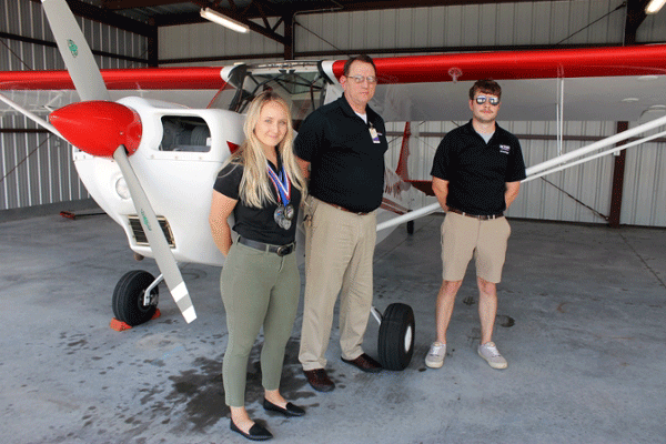 L-R are Angela Rogers, MGA Aerobatics Club president, Gene Behrends, assistant chief flight instructor, and Bobby Jeanes, flight instructor.